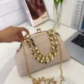 Elegant beige pleated shell bag featuring a chunky gold chain and thin shoulder strap - Khaki