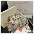 Elegant vintage floral jacquard clutch bag with decorative gold frame and crossbody chain strap - Pastoral Flower