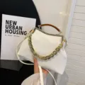 White seashell handbag with elegant striped texture and trendy acrylic gold chain strap - White