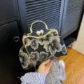 Elegant black floral embroidery shell bag with pearl clasp and gold chain strap - Black