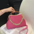 Vibrant pink woven handbag featuring an acrylic top handle and large gold chain - Rose Red
