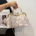 Elegant cream embroidered floral evening clutch with gold metal handle and pearl clasp - Pink