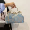 Elegant blue embroidered floral handbag with pearls and gold metal handle - Blue
