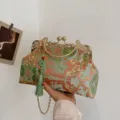 Sage green embroidered crossbody bag with traditional lion patterns and tassel detail - Green