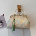 Elegant vintage floral embroidered handbag featuring a green tassel and gold chain - Blue
