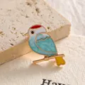 Close-up of elegant blue and red enamel bird brooch pin on a textured background - White Bird (XZ02-012) / White
