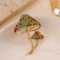Elegant golden mushroom brooch featuring vibrant multi-colored rhinestone accents - Colorful Mushroom