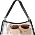 Detailed view of a clear PVC shoulder bag showcasing spacious interior with accessories - Black PU Handle