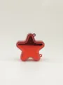 Close-up of a small star-shaped red acrylic handbag with a shiny metallic finish - Red