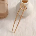 Detailed macro shot of a golden U-shaped hair fork featuring a minimalist knotted top - Gold Knot (11x2.7cm)
