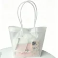 Detailed view of the frosted TPU material and the spacious interior of the tote - White
