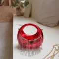 Red circular acrylic evening clutch bag featuring elegant sparkling rhinestone fringe tassels - Red