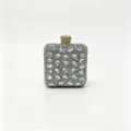 Close-up of silver rhinestone evening clutch bag with sparkling crystal embellishments - 12.5x7x15cm / Silver