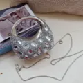 Close-up of a silver rhinestone evening bag with moon shape and ball chain strap. - 13*5*12cm / Silver Style 2