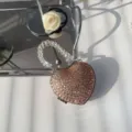 Detailed view of luxury heart-shaped rhinestone mini bag with elegant beaded handle - Champagne Round Diamond