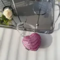 Detailed view of the sparkling pink rhinestone heart-shaped mini evening bag - Pink Flat Rhinestone