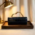Vintage dark blue crocodile texture clutch bag with wavy gold metal handle detail. - Black