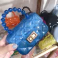Mini blue transparent jelly bag with quilted pattern and unique beaded handle detail. - Transparent Blue