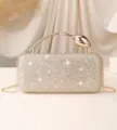 Detail view of luxury rhinestone evening clutch bag with elegant rose flower handle - Gold