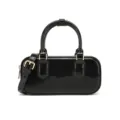 Close-up of a glossy black patent leather handbag featuring elegant gold hardware. - 220*80*100mm / Black