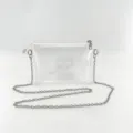 Close-up detail of a minimalist clear PVC mini bag with a silver metal chain strap - 20*4*14cm / Silver
