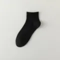 Chaussettes unies noires pour hommes, en coton confortable, idéales pour le travail et les loisirs. - Noir