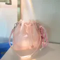Pink frosted TPU jelly bucket bag with drawstring closure and knotted charm - Pink