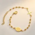 Vista dettagliata del bracciale rosario in oro e acciaio con croce e medaglia mariana. - Bracciale Vergine Maria / Oro