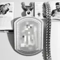 Close-up of the intricate etched patterns on a men's rectangular stainless steel pendant - Silver Arabic Plate - Pearl Chain