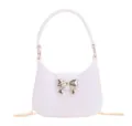 Stylish lavender PVC jelly bag with metallic bow clasp and delicate gold chain strap - White