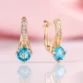 Elegante goldfarbene Huggie-Ohrringe mit runden blauen Steinen - Blaue Kunststein-Ohrclips (T6-Gold) / Gold/Blau
