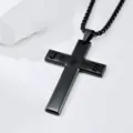 Detailed macro shot of black stainless steel cross necklace featuring hollow Jesus letters - Cross Pendant Necklace / Black