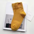 Mustard yellow mid-calf socks for women, comfortable cotton knit with cute leaf embroidery. - One Size / Turmeric