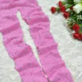 Pink rhinestone fishnet pantyhose detail view, showing sparkling crystal stones on mesh fabric. - One Size / Pink