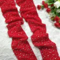 Rhinestone mesh stockings detail showing sparkling crystal diamonds on red fishnet fabric texture. - One Size / Red
