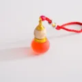 Decorazione auto, ciondolo diffusore di profumo a zucca rossa con tappo in legno e oro. - Rosso