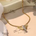 Close-up view of gold angel wing necklace with precise size and weight measurements. - Angel Necklace / Gold and Silver Two-tone