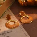 Close-up detail of vintage caramel enamel and textured gold statement hoop earrings. - Caramel Large Hoop Pendant Style (23041B)