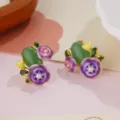 Close-up detail of elegant spring floral earrings with enamel petals, pearls and green stones. - Oval Green Stone Gradient Purple Five-Petal Flower Earrings