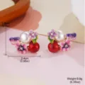 Detailed view of floral enamel earrings with dimensions 2.4x1.8cm and 9.9g weight - Purple Pink Flower Cherry Fruit Earrings