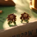 Detailed macro view of French vintage style enamel flower stud earrings with gold-tone finish - Dark Brown-Red Stamen (22461A)