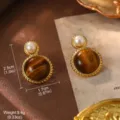 Vintage tiger eye earrings with pearl detail, size 2.5x1.7cm, elegant gold frame design - Tiger Eye Pearl Earrings (2-19580E-6500)