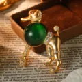 Macro detail of a vintage French style poodle brooch with green bead and crystals. - Green Poodle Brooch (BR1-2266-8500)
