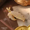 Detailed close-up of a vintage pearl feather brooch with dimensions 8.2cm x 3.0cm. - Gold Feather Pearl Brooch (BR-0437E-7000) / Brooch Style