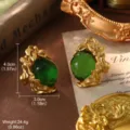 Detailed view of vintage gold floral earrings with large green stones and dimensions - Green Transparent Gem Style (E4-19500C-6000) / Clip-on Style
