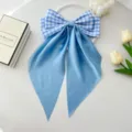 Close-up of blue gingham and satin ribbon bow hair clip on elegant white setup - Sky Blue Small Plaid