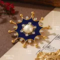 Close-up of luxury vintage geometric flower brooch with blue enamel and central pearl - Radial Blue Enamel Style (BR1-2556-5000)