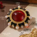 Detailed macro view of a vintage flower brooch with a red center stone and pearls - Red Stone Black Enamel Flower Style (BR1-2560A-6500)