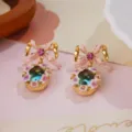 Detailed close-up of vintage enamel flower earrings with a pink bowknot and gem - Pink Bow Gradient Garland Earrings