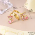 Detailed view of gold flower adjustable ring showing 3.9cm size and 10.7g weight - Double Pink Flowers (1-4343-6800)
